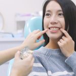 Woman talk to dentist in dental clinic