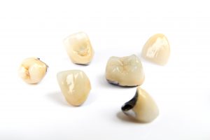 Dental ceramic tooth crowns on white background. Isolated.