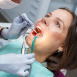 Examination oral cavity or treatment teeth, visiting dental office, soft focus background