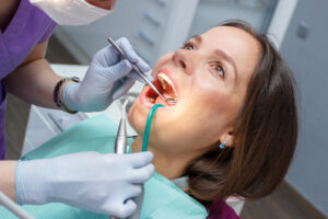 Examination oral cavity or treatment teeth, visiting dental office, soft focus background