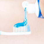 toothpaste is applied to the toothbrush,tooth brushing in hand