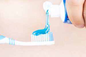 toothpaste is applied to the toothbrush,tooth brushing  in hand
